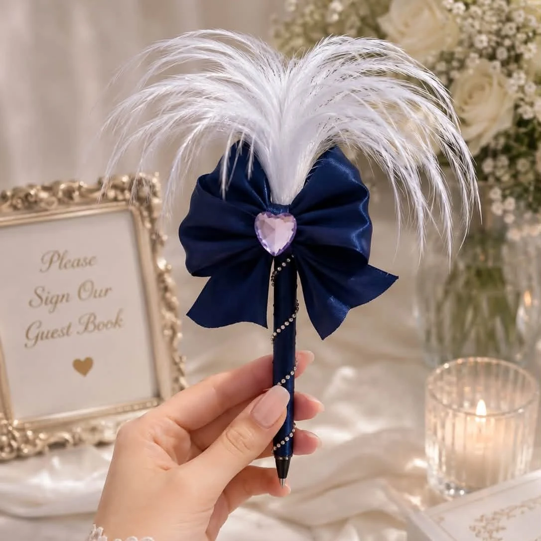 Navy satin feather pen, finished with a heart detail