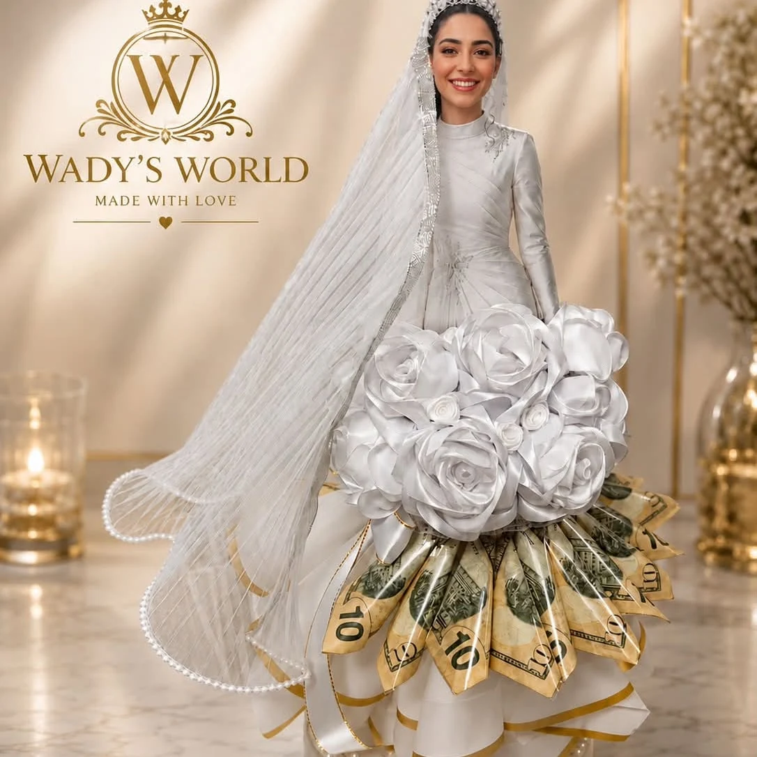 White satin roses and a personalized bridal money bouquet